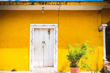 door surrounded by a yellow wall